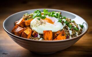 AI generated Buddha bowl with quinoa, fried egg and sweet potato photo