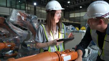 Both of engineers working together in a robotic arm factory, Robotic arm industry and engineering concept. photo