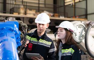 Both of engineers working together in a robotic arm factory, Robotic arm industry and engineering concept. photo