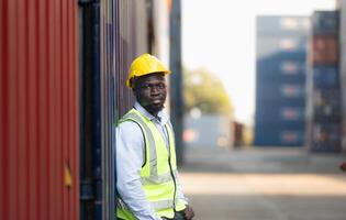 Portrait of male worker in front of container photo