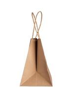 Kraft craft paper bag with handles, side view, isolated on white background photo