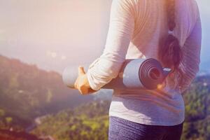 Woman standing with yoga photo