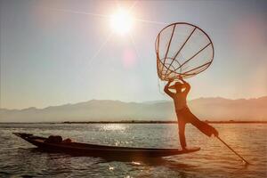 Traditional Burmese fisherman at Inle lake, Myanmar photo