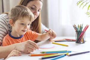 Mother and Child Enjoying Drawing Time Together photo