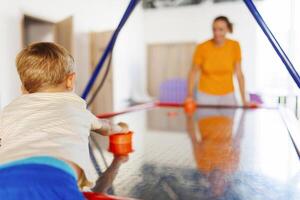 Air Hockey Fun with Mother and Child photo