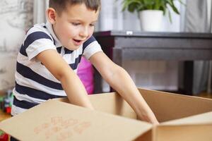 Child Excited by Surprise in Box photo