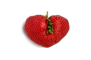 Ugly strawberry in the shape of a heart. Funny, ugly vegetables. photo