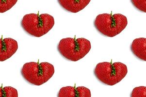 Ugly strawberry in the shape of a heart on s white background. Seamless pattern. Funny, ugly vegetables. photo