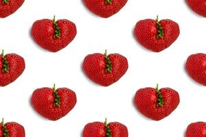 Ugly strawberry in the shape of a heart on s white background. Seamless pattern. Funny, ugly vegetables. photo