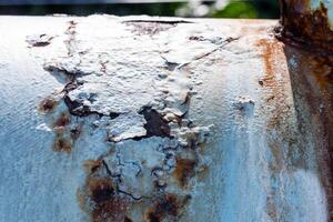 Rusty Metal Grunge Texture on the wall of an old water pipe. Corrosion of objects. photo