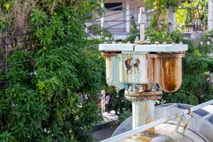 City water metal pump that has been corroded by weather until rust occurs. Copy space. photo