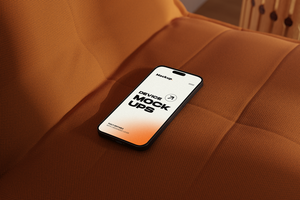 Mobile phone mockup on sofa psd