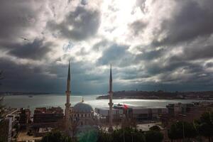 Nusretiye Mosque and Istanbul view with cloudy sky from Cihangir photo