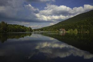 Bolu Golcuk Nature park in Bolu Turkey. Lake and forest with cloudy sky photo