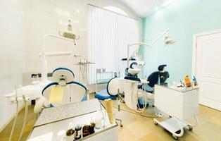 An empty chair in the dentist's office. Empty dentist's office photo