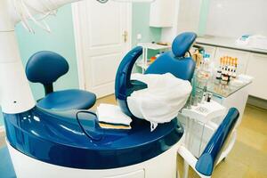 An empty chair in the dentist's office. Empty dentist's office photo