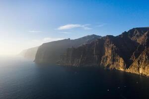 Top view of the Giant Rocks of Acantilados de Los Gigantes at sunset, Tenerife, Canary Islands, Spain photo