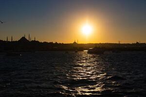 Silhouette of Istanbul at sunset. photo