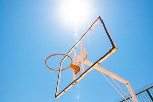 Broken backboard of basketball court in the park. Vandalism concept photo