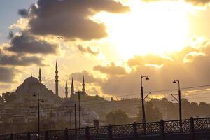 Istanbul view at sunset with dramatic clouds. Ramadan or islamic concept photo