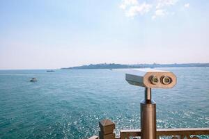 Visit Istanbul background photo. A binocular on the balcony of Maiden's Tower photo