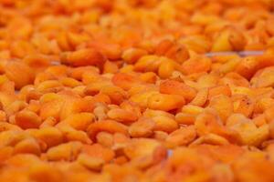 Dried apricot production background photo. Organic vegan foods concept photo