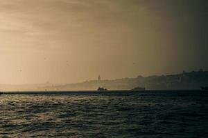 Istanbul background photo. Sepia colored Istanbul background at foggy weather. photo
