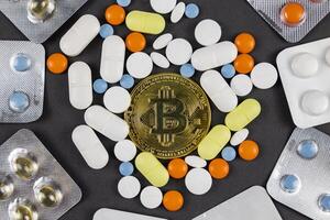 Paying medical bills with bitcoin or cryptocurrency concept photo
