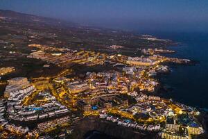 Top view of the houses located on the rock of Los Gigantes at sunset, Tenerife, Canary Islands, Spain photo