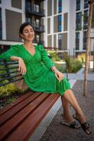 Portrait of young beautiful caucasian brown hair woman posing outdoor in the city photo