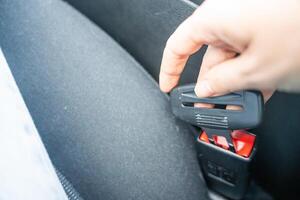 Artificial seat belt plug.Violation of traffic rules. Irresponsible driving and behavior concept photo