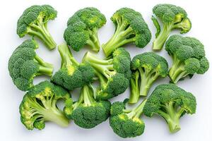 AI generated A Pile of Broccoli Florets on a White Surface Fresh broccoli florets arranged neatly on a clean white surface. photo