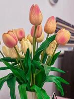 Artificial Yellow Tulips in White Vase photo