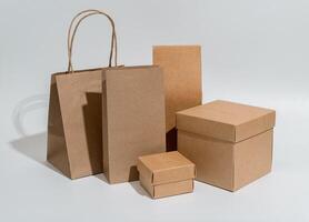 Kraft packages, boxes, bag, brown beige packs for gifts, purchases set photo