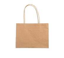 Kraft paper bag with handles. Brown beige pack, package isolated on white background photo