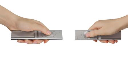 Hand holding remote control, TV switch isolated on white photo