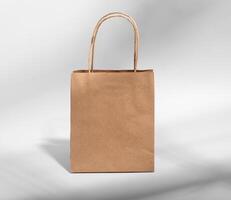 Kraft paper bag with handles, brown gift package, craft pack photo