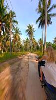 Woman Riding Scooter On Tropical Island video