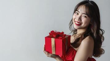 ai generado un sonriente joven mujer vistiendo rojo vestir participación rojo regalo caja aislado en blanco fondo, foto