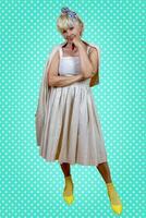 Funny portrait of mature woman. A beautiful lady is wearing a 50s style dress. photo