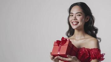 ai generado un sonriente joven mujer vistiendo rojo vestir participación rojo regalo caja aislado en blanco fondo, foto