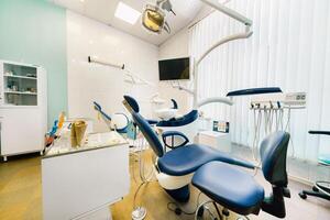 An empty chair in the dentist's office. Empty dentist's office photo