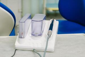 Ultrasonic scaler in the dental office. Dentistry Concept photo