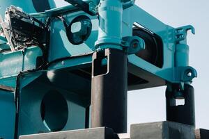 installing a counterweight on a truck crane. detail of the truck crane.Autoparts. photo