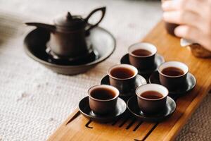 Preparing for a tea ceremony with a large company photo