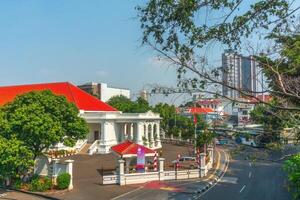 Indonesian morning view in the city of Jakarta during a beautiful morning with sunrise and tall buildings photo