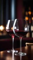 AI generated Glass of red wine on table in bar, blurred moody dark background, selective focus photo