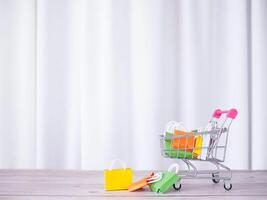 Shopping cart with shopping bags. Concepts about online shopping that offers home delivery photo