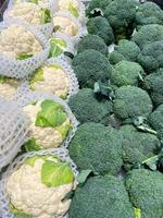 Close up broccoli and cauliflower in supermarket. The concept of health foods photo