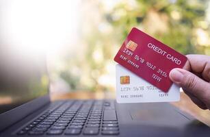 Woman hand holding several credit cards. The concept of Convenience in the world of technology and the internet, Online shopping, banking transaction, banking online and payment photo